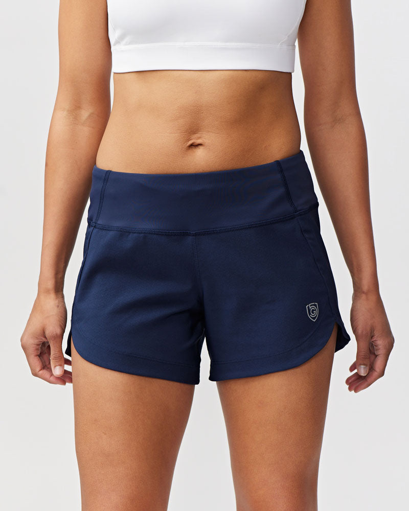 Navy blue Goal Five Excel women's workout shorts with a hidden pocket and a subtle logo on the left leg.