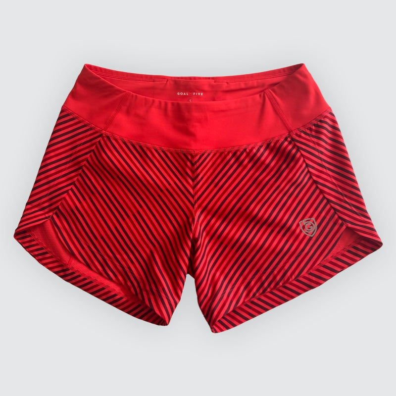 Red Goal Five Excel women's workout shorts with black diagonal stripes and a small logo on the right leg.