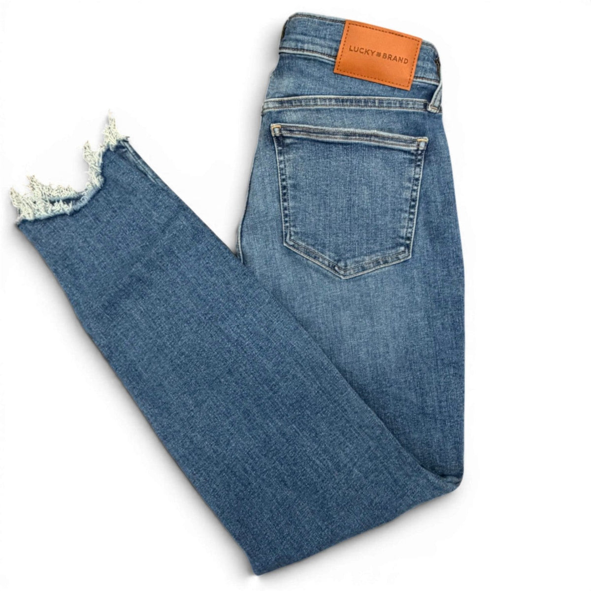 Lucky Brand Women's Mr Ava Skinny Jeans in Wild Light wash with distressed hem.