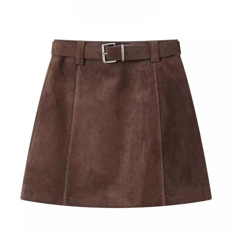 Brown suede A-line mini skirt with a high waist, matching belt, and decorative vertical stitching.