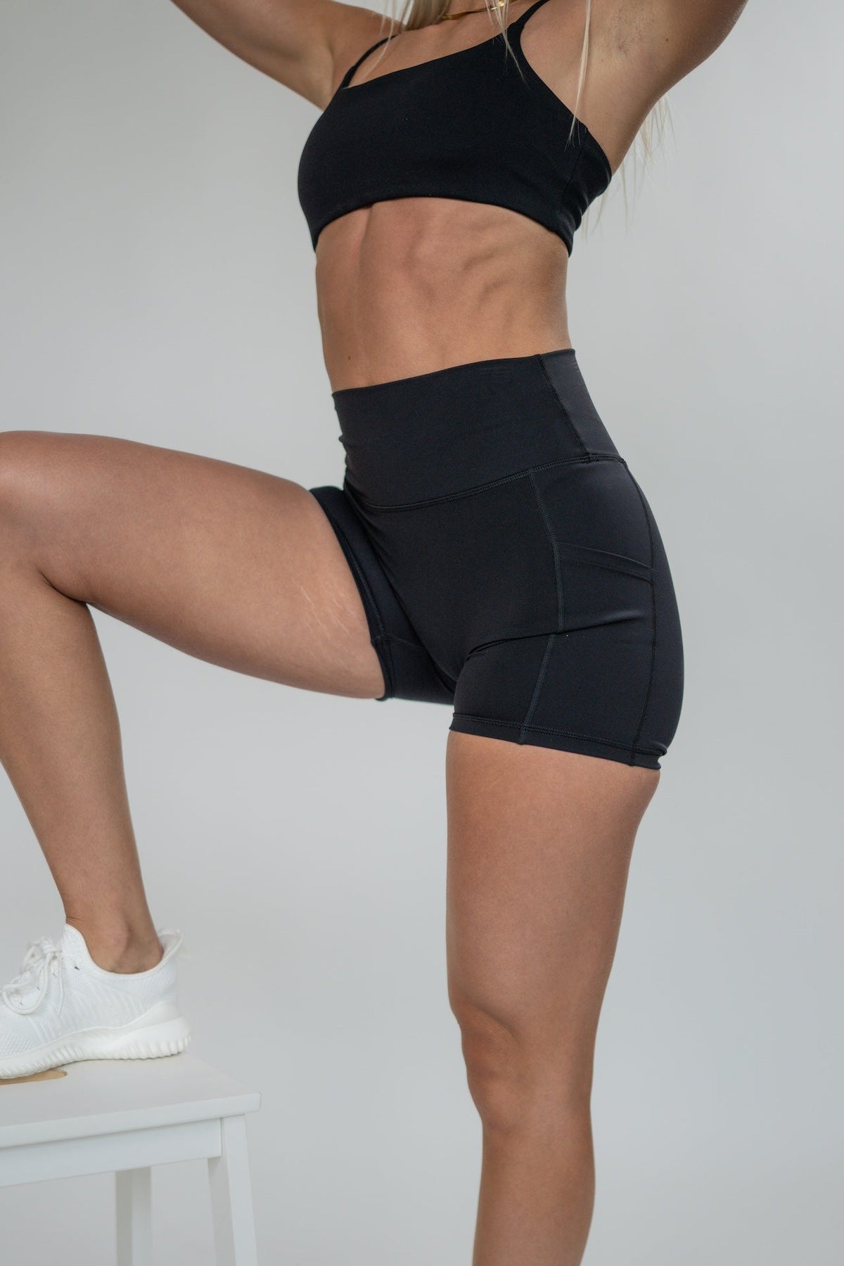 Alyth Active GRAVITY Catalyst V2 High Rise Biker Shorts in black, featuring a high waist and side pockets.