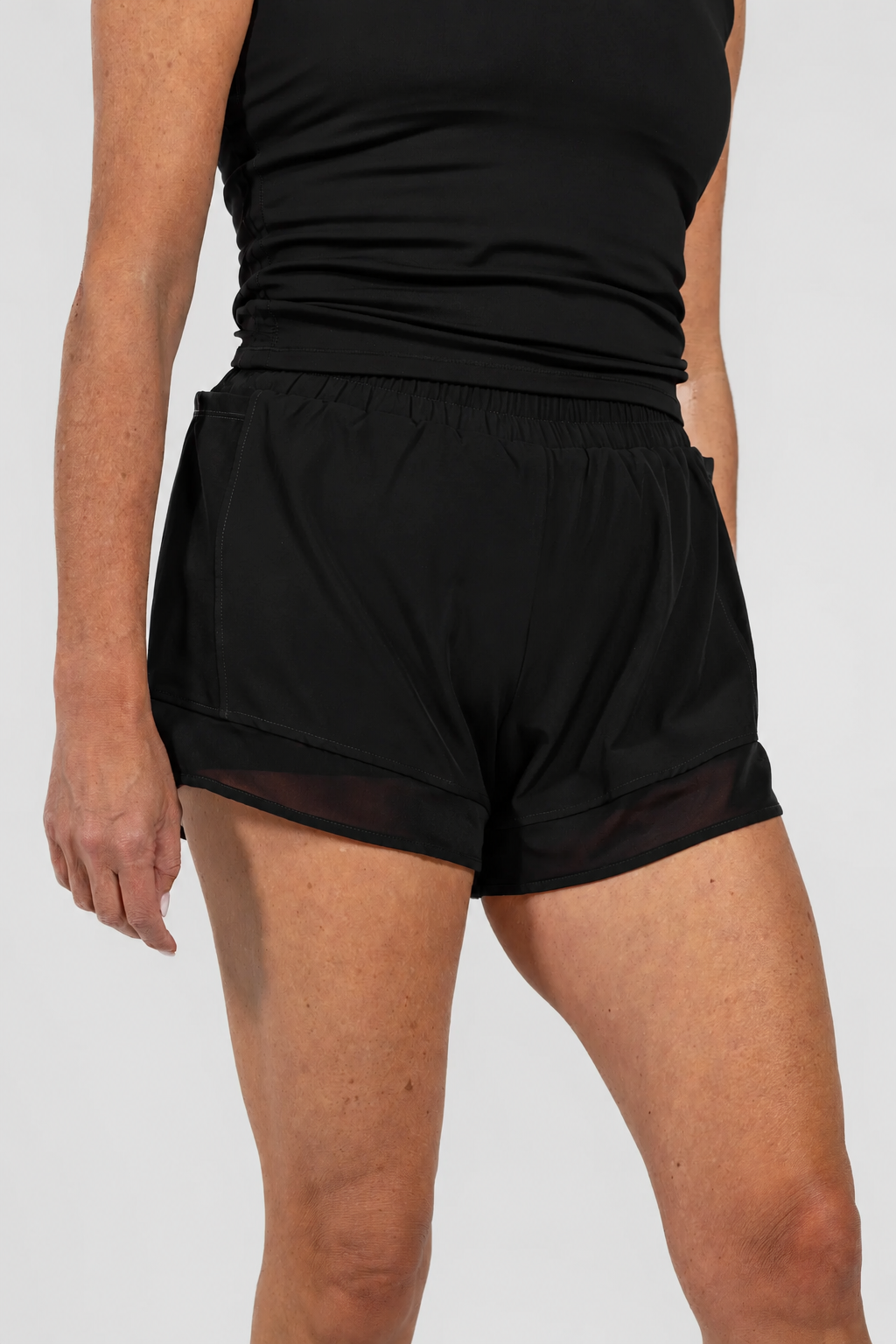 Black Alyth Active Empowered V3 Mid Rise Shorts with mesh side pockets and built-in shorties.