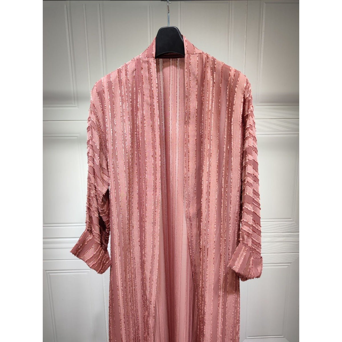 Vintage pink knitted longline open-front cardigan abaya with vertical stripes and fringe details.