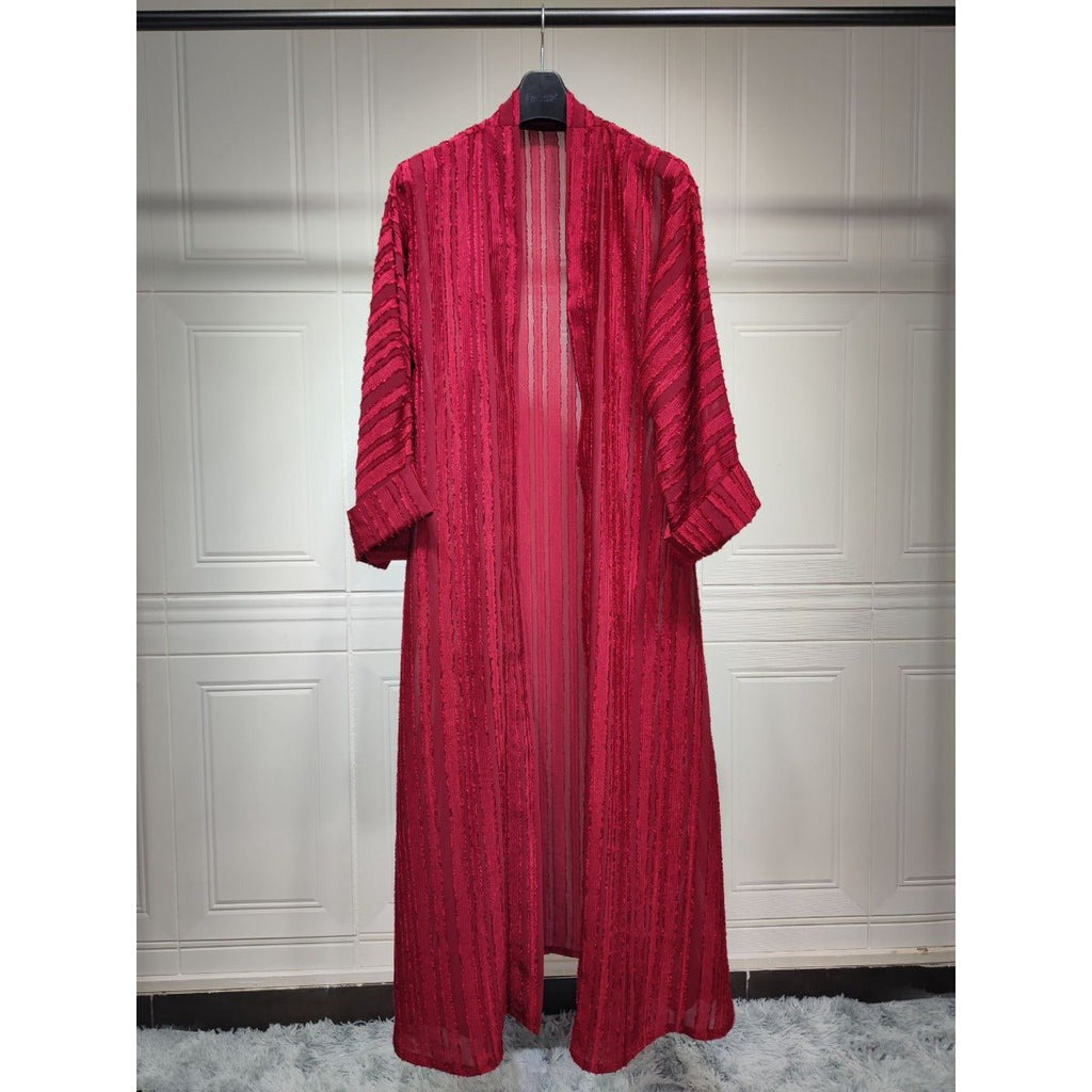 Red longline open-front knitted cardigan abaya with vertical stripes and fringe details.