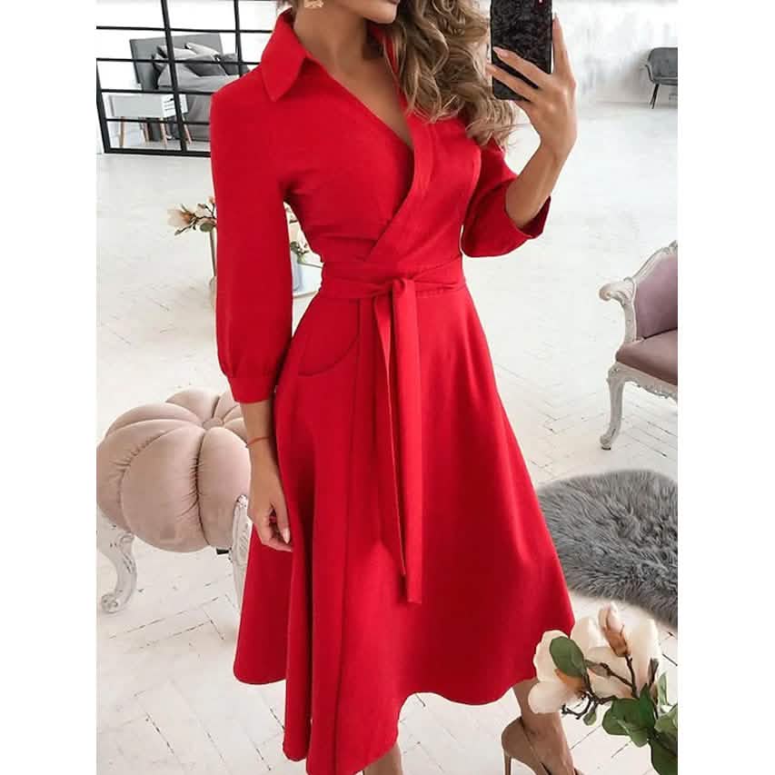 Red A-line midi dress with V-neck, tie waist, and 3/4 sleeves.